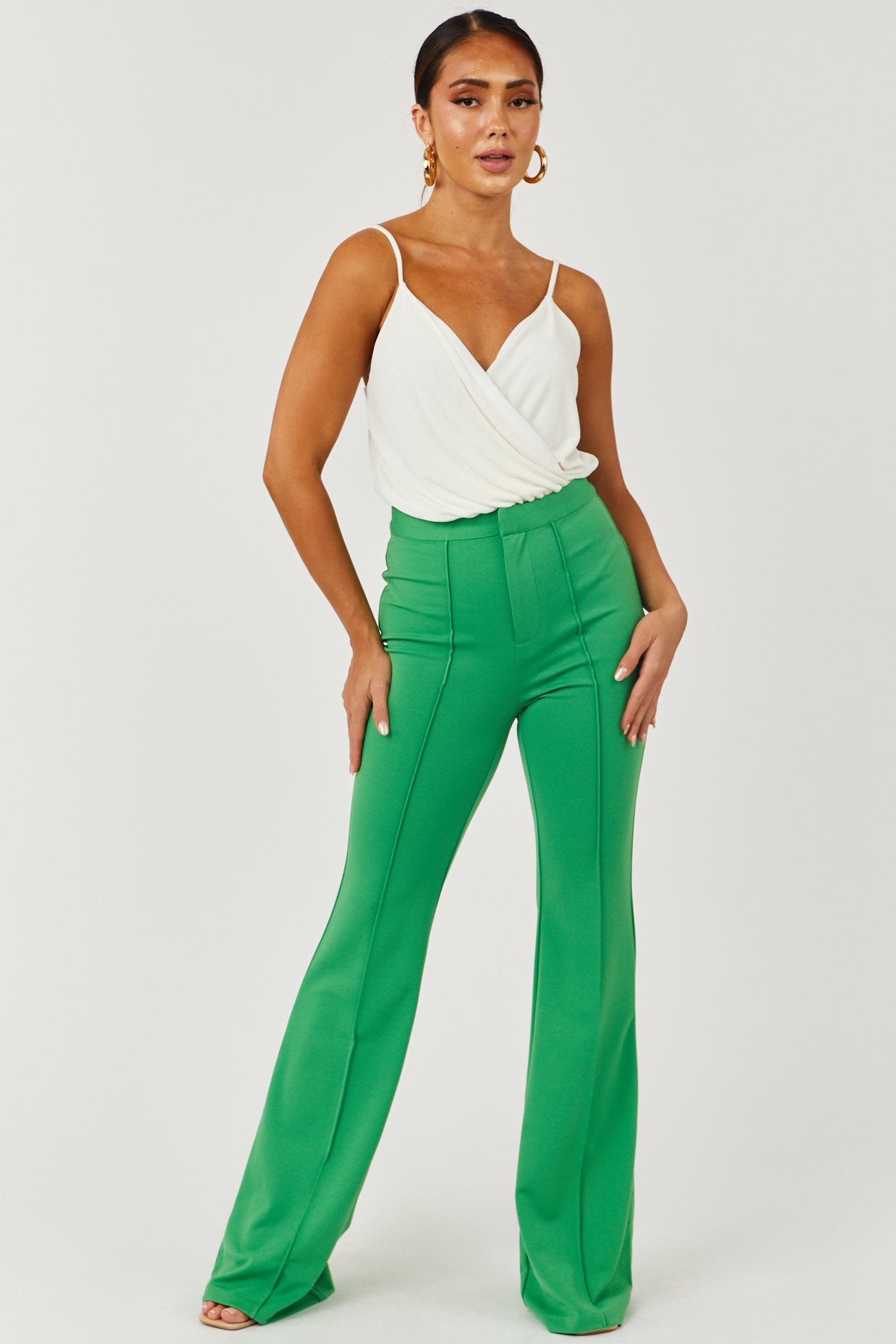 http://www.limelush.com/cdn/shop/files/Green-High-Rise-Flare-Pants-with-Seam-Detail-front_08162023.jpg?v=1692378064