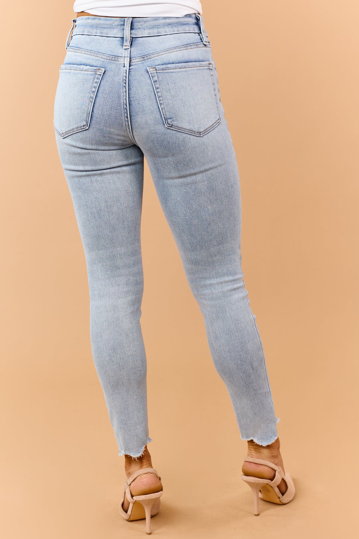 Light Wash Mid Rise Raw Hem Stretchy Skinny Jeans