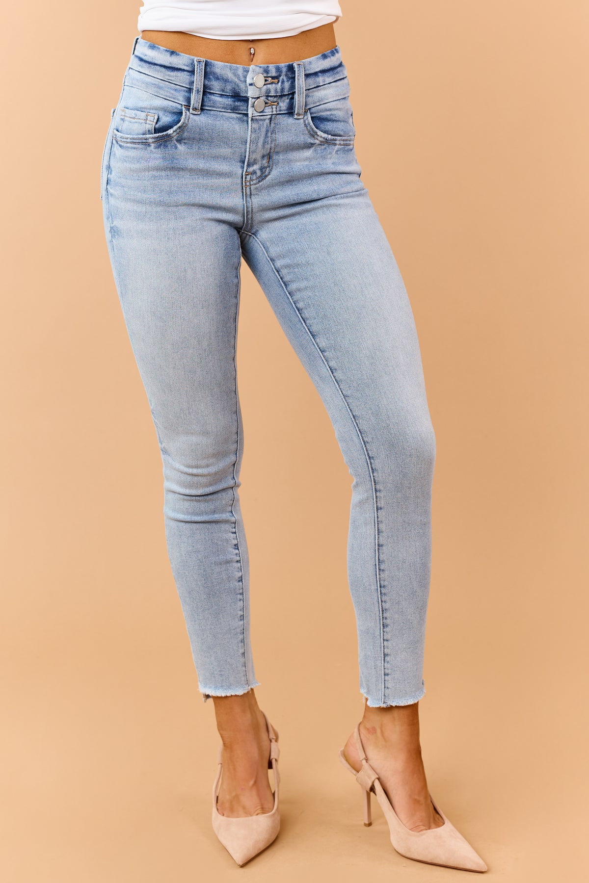 Light Wash Mid Rise Raw Hem Stretchy Skinny Jeans