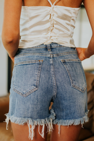 Medium Wash High Rise Distressed Frayed Hem Shorts