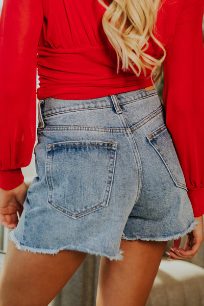 Medium Wash High Rise Distressed Mom Shorts