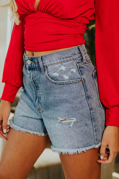 Medium Wash High Rise Distressed Mom Shorts