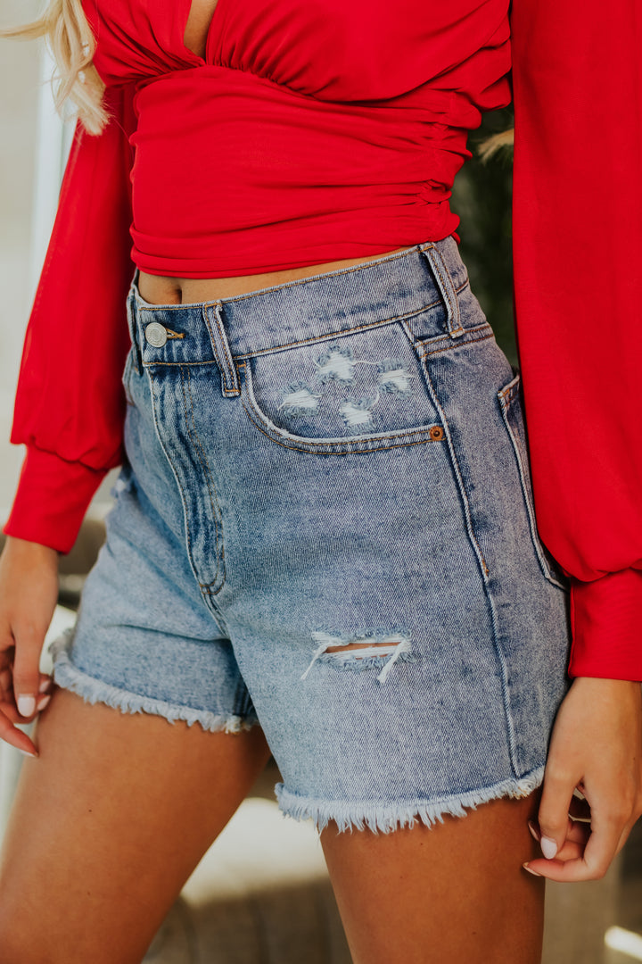 Medium Wash High Rise Distressed Mom Shorts