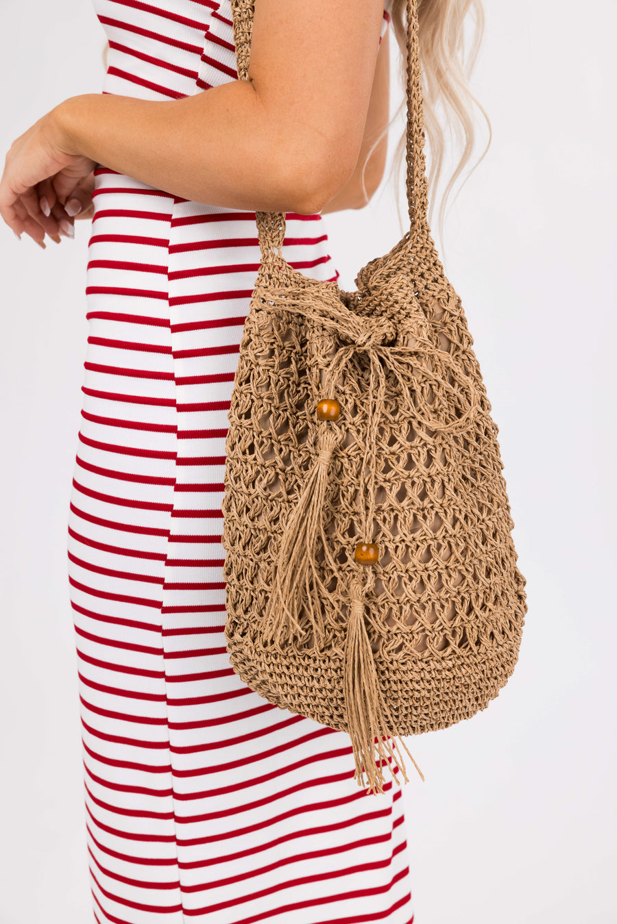 Sepia Eyelet Straw Tassel Drawstring Tote Bag