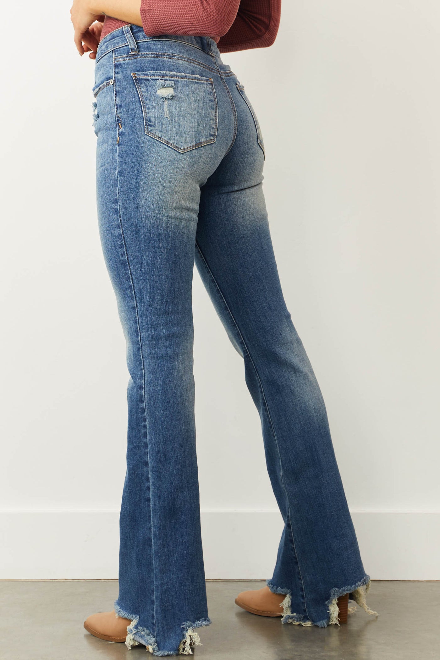 Medium Mid Rise Distressed Flared Jeans