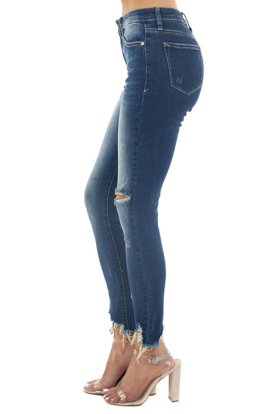 Medium Dark Wash Mid Rise Skinny Jeans with Shark Bite Hem