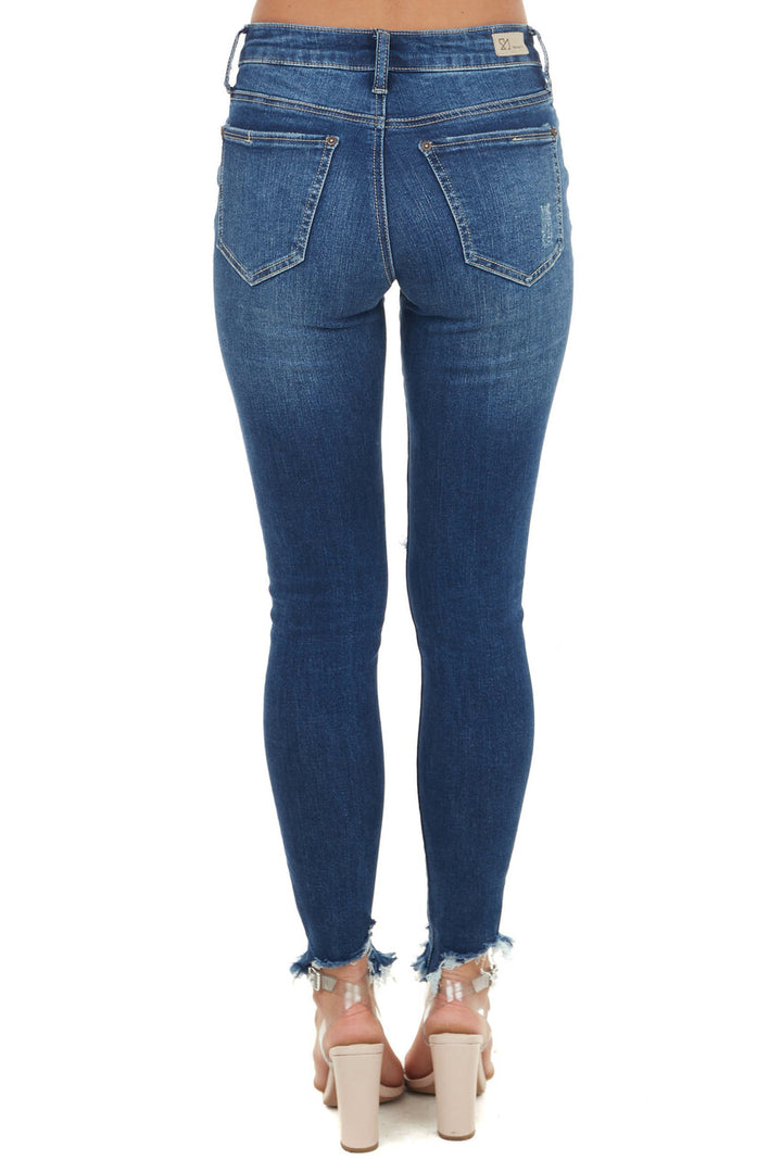 Medium Wash Mid Rise Skinny Jean with Distressed Details