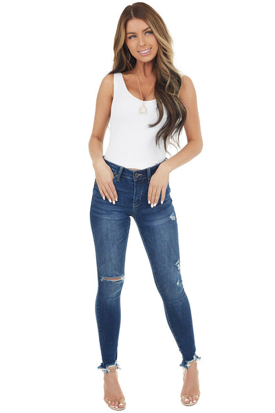 Medium Wash Mid Rise Skinny Jean with Distressed Details